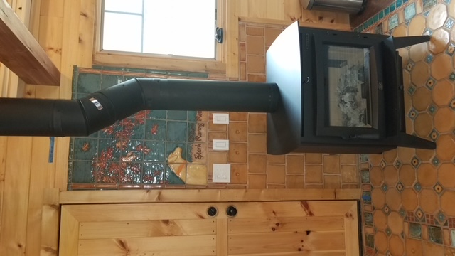 Floor and wall tile mural for woodstove in guest cabin